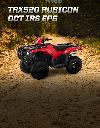 TRX500 Rubicon DCT IRS EPS. Ready for the challenge. Image of ATV rider powerfully steering up rugged dirt trail in the forest