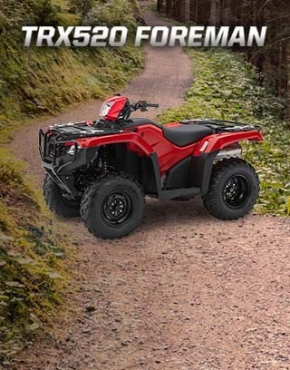 "Honda's line of ATVs has earned a solid and well-deserved reputation for being some of the most durable ATVs on the planet" - quote by Outdoorlife.com. Image of rider in denim shirt driving through thick muddy trail in the forest.