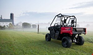 Pioneer 520 parked in a grassy field